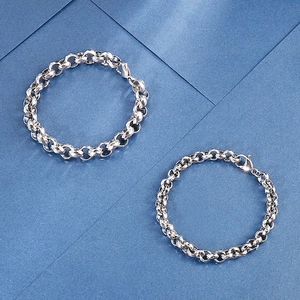 Close-up of polished 304 stainless steel pearl chain links on a blue background