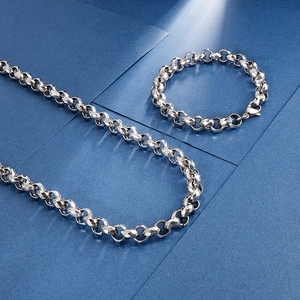 Detailed view of silver stainless steel faceted chain necklace and bracelet set