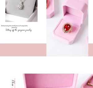 Pink velvet jewelry box detail showing velvet interior slots for rings and pendants