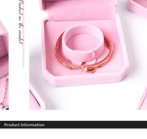 Rose gold bangle with sparkling crystals and star charm in a pink velvet jewelry box