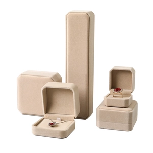 Elegant beige octagonal velvet jewelry box set for rings, necklaces, and bracelets