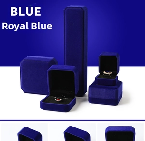 Detailed macro view of royal blue velvet jewelry box collection for rings and necklaces
