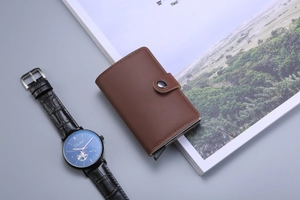 Brown leather popup card holder with automatic slider and blue dial leather watch
