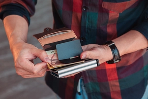 Brown PU leather wallet with metal card holder mechanism for cards and folded cash bills