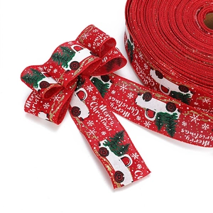 Red Christmas ribbon with white truck and tree prints for festive gift wrapping