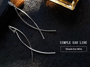 Detailed view of S925 sterling silver long tassel ear lines on a dark textured background