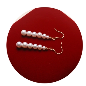 Elegant linear freshwater pearl drop earrings with S925 silver hooks on red velvet