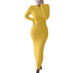 Detail of yellow cable-knit long-sleeve slim dress showing rich texture and weave
