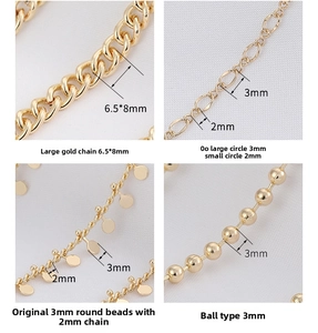 Macro detail of four styles of golden copper bead and flat O-shaped jewelry chains