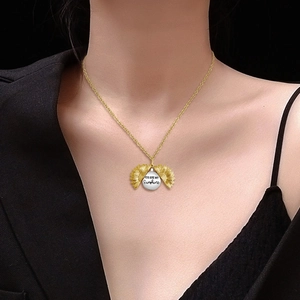 Golden sunflower necklace with You Are My Sunshine engraving on a round disc pendant