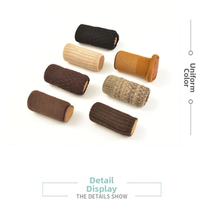 Detail showing 7 colors of knitted chair leg protectors with thick weave texture