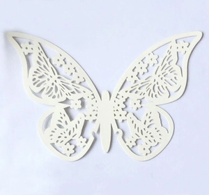 Detail of ivory 3D butterfly wall sticker with intricate floral hollow-out patterns