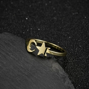 Minimalist gold stainless steel open ring featuring crescent moon and star on black stone