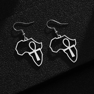 Detailed close-up of silver African map earrings with Ankh cross symbol on black background