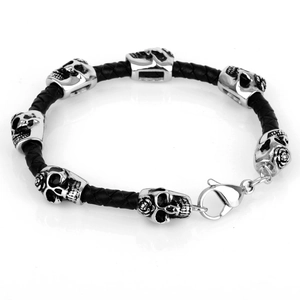 Men's gothic braided leather bracelet with silver skull charms and lobster clasp