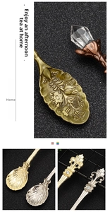 Detail showing vintage zinc alloy coffee spoons with floral relief and crystal inlay
