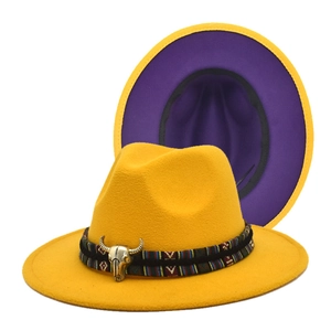 Detail of wool fedora with cattle skull metal buckle and ethnic woven band accents