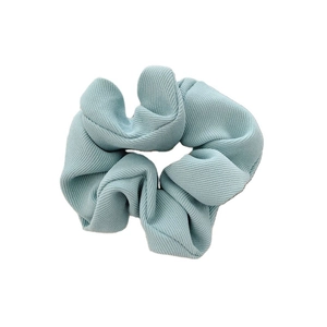 Light blue ribbed fabric scrunchie with high elasticity for elegant hair styling