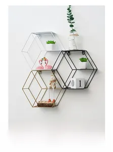 Three-color geometric hexagonal iron wall shelves in black, white and gold for modern decor