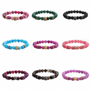Variety of 8mm stone beaded bracelets featuring detailed metal skull charms in 9 styles