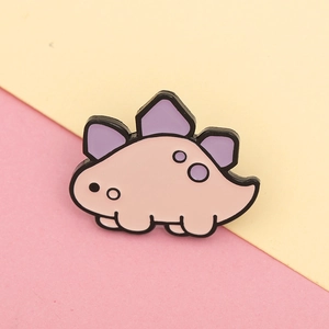 Detailed close-up of a cute pink stegosaurus enamel pin with purple scales and metal lines