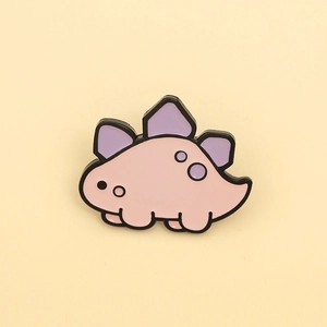 Detailed view of a cute pink and purple cartoon dinosaur enamel brooch made of alloy