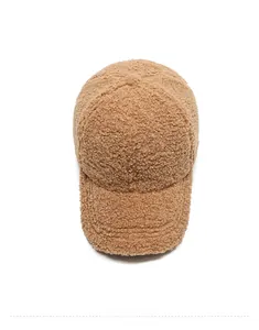 Top view of brown teddy fleece baseball cap showing soft texture and warm winter material