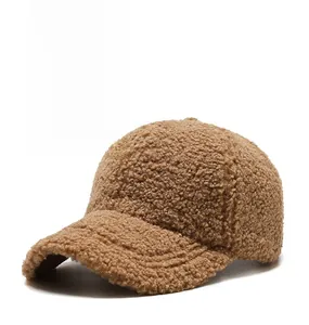 Detail of caramel faux shearling texture on a thick winter baseball cap for women