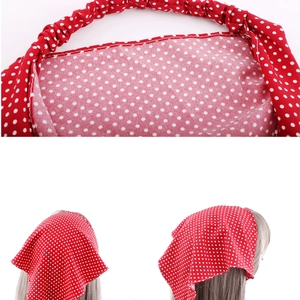 Detail of red hair bandana with white polka dots featuring an elastic strap and model view