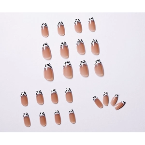 French cow print press-on nails in purple-gray and nude tones with oval shape