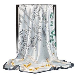 Detailed close-up of premium satin scarf featuring classic equestrian harness print patterns