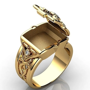 Macro detail of men's gold hip hop ring featuring an openable secret square flip box