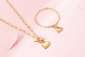 Golden heart pendant jewelry set with paperclip chain bracelet and necklace