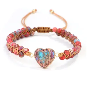 Detailed view of handmade woven wrap bracelet with heart-shaped natural stone and beads