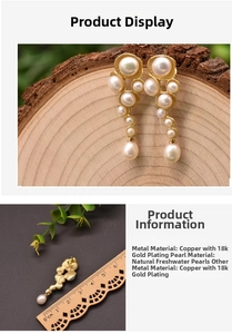 Close-up of 18K gold plated drop earrings with natural freshwater pearls and ruler measurement