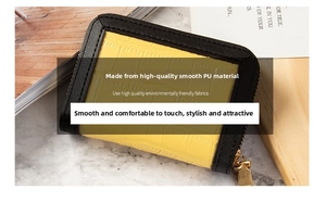 Detail of yellow crocodile pattern PU leather card holder with gold metal zipper