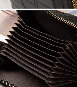 Close-up of internal multi-layer accordion card slots and metal zipper on brown wallet