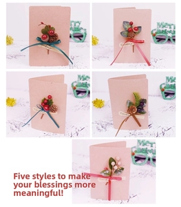 Detailed view of handmade Christmas cards with pinecones and berries for DIY gift decor