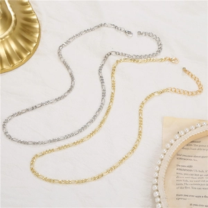 Classic gold and silver NK link chain necklaces for men on a soft white background