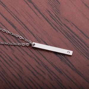 Polished silver titanium steel necklace with a rectangular pendant and single diamond accent