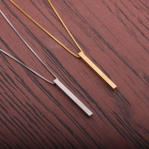 Titanium steel bar pendant necklace in gold and silver mirror finish on wood