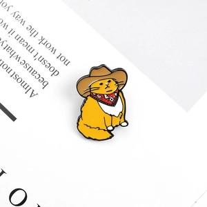 Cute cartoon ginger cat enamel pin with cowboy hat and scarf on decorative paper