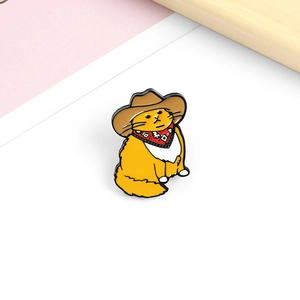 Cute yellow cartoon cat enamel pin in cowboy outfit with red scarf and hat accessory