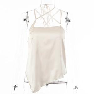 Detailed view of cream satin halter top featuring irregular hem and silk texture on mannequin