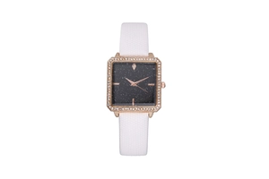 Detail of square rose gold watch with sparkling starry dial and diamond bezel
