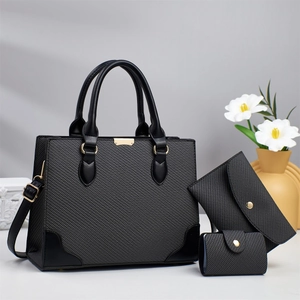 Three-piece grey tote bag set with textured fabric, crossbody pouch and card holder