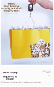 Detail showing high bearing capacity of large yellow paper gift bag with pet patterns