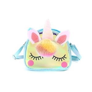 Detail of laser iridescent unicorn crossbody bag with plush pom-poms and adjustable strap