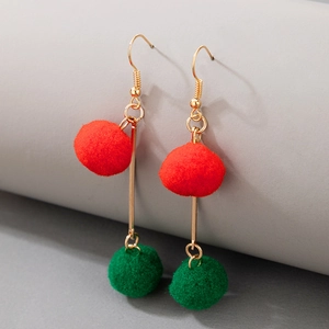 Detail of Christmas drop earrings with red and green pom-poms on gold-plated metal bars