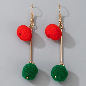 Detailed view of Christmas earrings with vibrant red and green plush pom poms on gold hooks